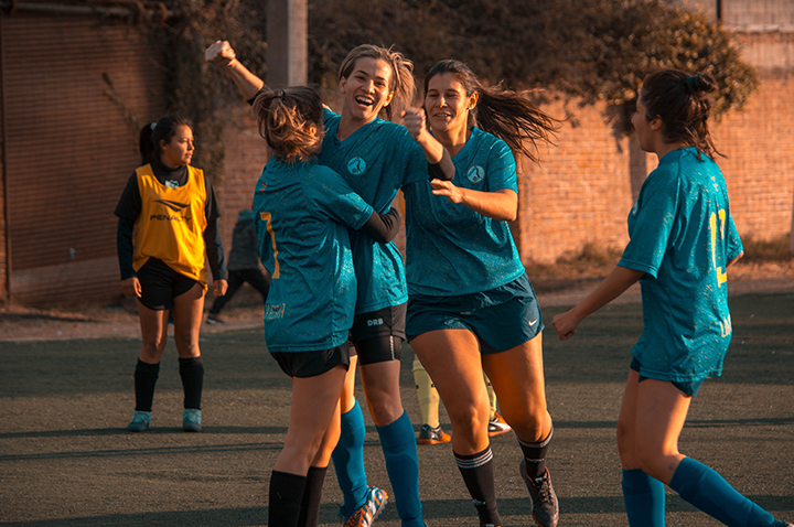 soccer players celebrating victory